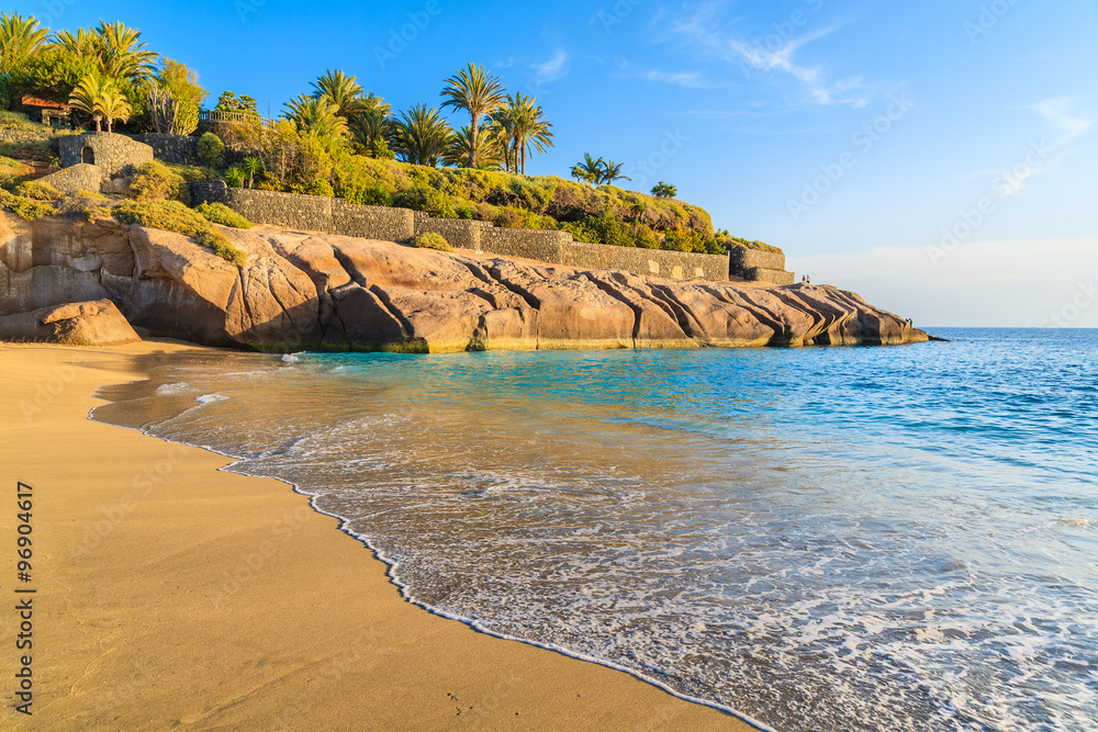 Wall mural ocean wave on tropical sandy el duque beach in costa adeje, tenerife, canary islands, spain