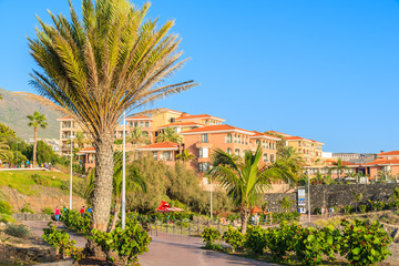 Coastal promenade in Costa Adeje holiday town, most popular place in southern Tenerife, Canary Islands, Spain.