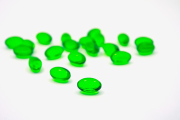 green pills soft gel capsule isolated on white background