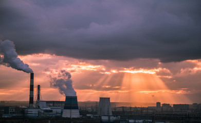 View in thermal power plants. Through the large clouds punched bright sunlight.

