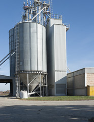 Farm with silo and storage space and some machinery