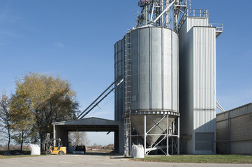 Farm with silo and storage space and some machinery