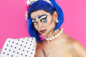 portrait model makeup with blue wig, on pink background, pop con