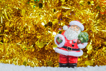 Santa Claus and golden ribbons on background with copy space
