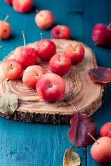 Red apples and leaves Wooden blue, turquoise background