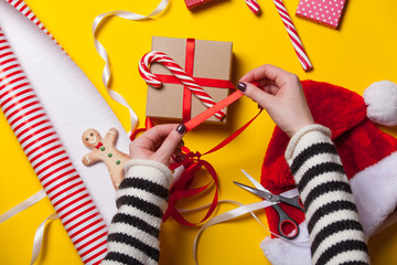 Female hands wrapping a gift