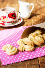Homemade cookies with cup of hot chocolate on wooden table