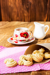 Homemade cookies with cup of hot chocolate on wooden table