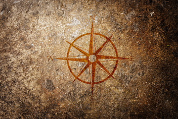 sign of compass on grunge background