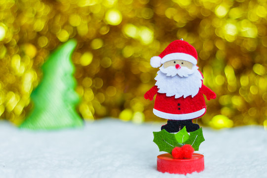 Santa Claus and golden ribbons on background with copy space