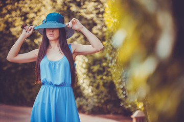 Beautiful young woman in summer garden