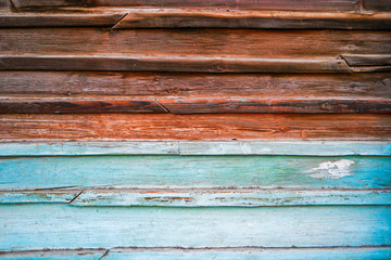 Old wooden background half painted in blue