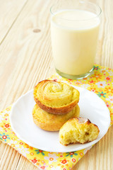 Sweet bread rolls with cottage cheese filling and a glass of yog