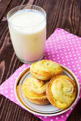 Sweet bread rolls with cottage cheese filling and a glass of yog