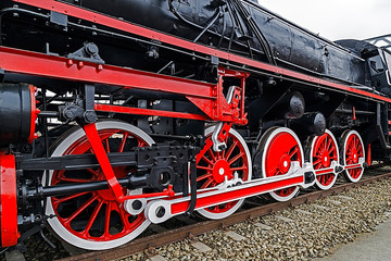 Detail and close up of huge wheels at one old german steam locom