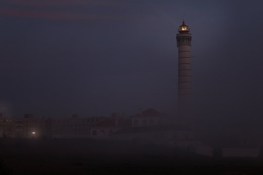 Lighthouse in a foggy dusk