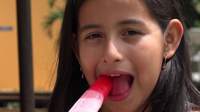 Young Girl Eating Popsicle
