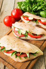 Raw chicken breasts stuffed with vegetables