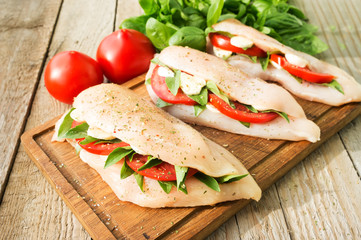 Raw chicken breasts stuffed with vegetables