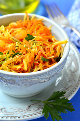 Spicy carrot salad with onion,cheese and parsley.