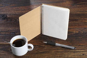 Notepad, coffee and pen