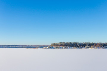 Frozen lake with ice and snow