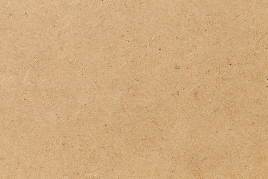 Pressed beige chipboard texture.