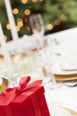 Christmas Gift with Place Setting at Table