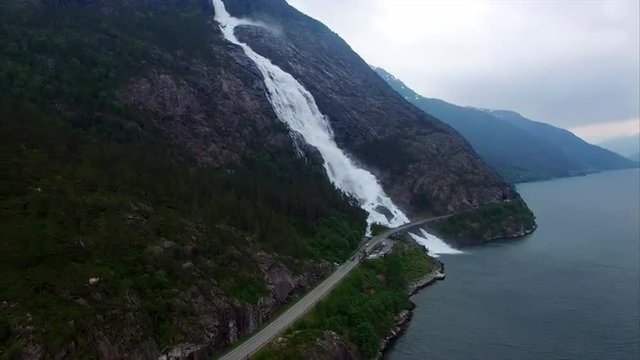 Aerial footage of beautiful massive waterfall Langfossen in Norway, popular tourist attraction. Aerial 4k Ultra HD.