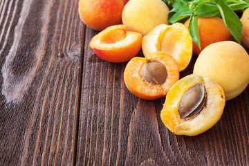 Fresh apricots on wooden table