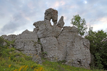 Rock in the form of stone palm with a finger to the sky.