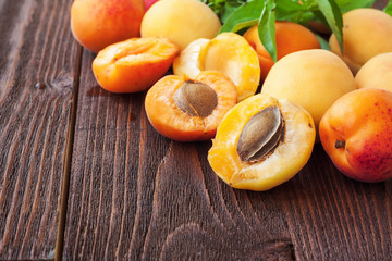 Fresh apricots on wooden table