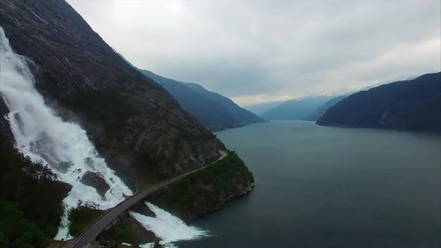 Aerial footage of road bridge over massive waterfall Langfossen in Norway, popular tourist attraction. Aerial 4k Ultra HD.
