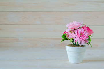 white flower pot on wooden table background