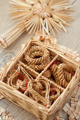 czech staw christmas decirations on vintage wooden table