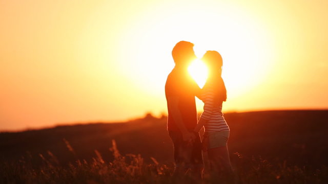 Loving couple during romantic date in poppy field