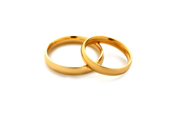Golden wedding rings isolated on a white