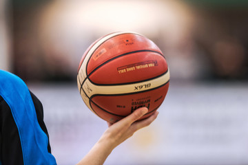 Closeup of referee holding ball at the Women European Basketball