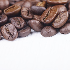 Macro image of coffee beans on white background