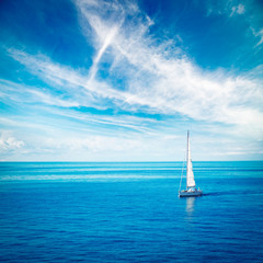Fototapeta premium White Yacht Sailing in Blue Sea