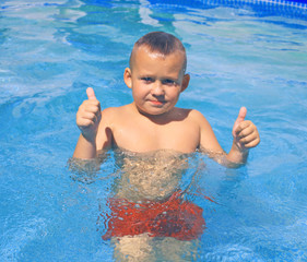 Little Boy in swimming pool. 