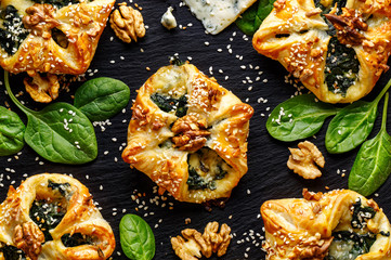 Spinach puffs with addition of gogonzola cheese, walnuts and sesame seeds
