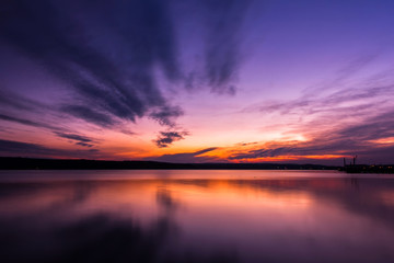 Dramatic long exposure landscape lake sunset