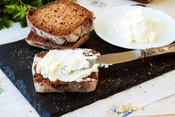 Rye bread and cream cheese with herbs