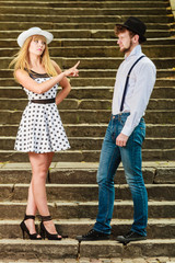 Loving couple retro style flirting on stairs