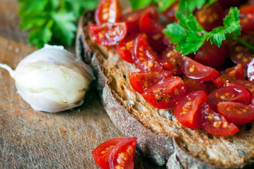 Italian bruschetta with cherry tomatoes on whole grain bread