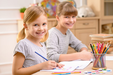 Fototapeta premium Pleasant little girl drawing 