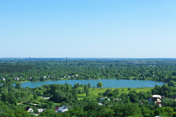 Obraz premium view to country houses at picturesque lake