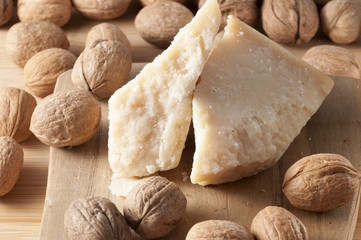 walnuts and cheese on a white background