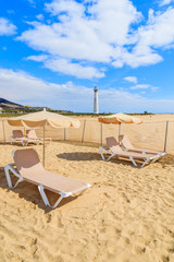 Sunbeds with umbrellas on Jandia beach, Fuerteventura, Canary Islands, Spain